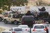 Militser, der er loyale over for general Khalifa Heftar, stormede søndag det libyske parlament i et forsøg på at afsætte regeringen. Det har fået islamistiske militser til at komme regeringen til undsætning. Foto: Libyan national army/AP