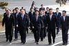 Den nordkoreanske delegation ankommer til mødet med Sydkorea. Foto: Korea Pool/Yonhap/AP